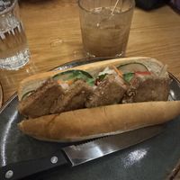 Bahn mi and Black Gold cocktail  at Doi Moi in Washington