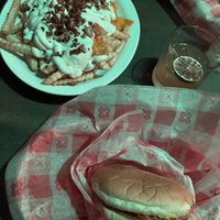 Bacon ranch cheese fries & happy hour burger  at Cycle Dogs in Seattle