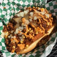 The trash dog: Soyrizo, crispy hash browns, caramelized onions, raw onion, chipotle vegan mayo, corn  at Cycle Dogs in Seattle
