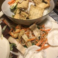 Steamed vermicelli with fried tofu in bowl with jackfruit salad below at Pho Vegan Asian Cuisine in Rocklin