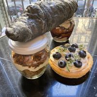 Carrot cake and tiramisu, mascarpone tarte and charcoal croissant  at La Besnéta in Barcelona