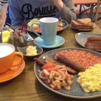 Two full english breakfasts with a soya latte and a chai tea latte.  at Vegan Hippo in London