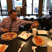 Somebody is happy with his pizza❣  at KC Artisan Pizza in Lakeland