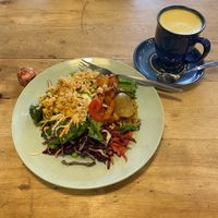 Salad plate & turmeric oat latte 🧡💛  at Seeds 2 Cafe in Totnes
