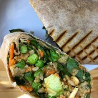 50/50 wrap w veggies, grains, miso and teriyaki . at Homespun Kitchen - Previously Happy Cup in Atlantic Beach