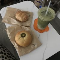 iced matcha latte with hemp milk, jalapeno sausage and chz kolache and breakfast croissant 💕💕  at Fat Cats in Austin