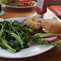 Impossible burger, they let you substitute fries for garlic sweet potato fries or sauteed vegetables with garlic as shown here at Half Moon Bay Brewing Company in Half Moon Bay