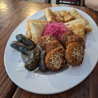 Falafel, vine leaf rolls, potato samosa and fried cabbage rolls at Mr Falafel in Maribor