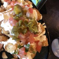 Tat-toes... tater tots with vegan crema  and pico...crispy and delicious  at Hussong's Cantina - Boca Park in Las Vegas