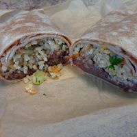 Vegan Burrito in deli aisle. Whole wheat wrap, refried black beans, brown rice, salsa with scallions and cilantro. at Mustard Seed Market - Highland Sqaure in Akron