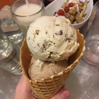Large waffle cone with butter pecan & cinnamon ice cream scoops at Cosmic Treats in Toronto