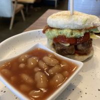 Vegan muffin with sausage and guacamole. Additional baked beans  at Theera in Bangkok