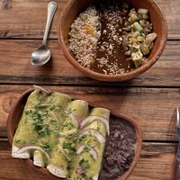 Enchiladas & mole with rice and veggies  at Suculenta in Tulum