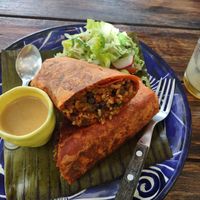 Updated menu for 2022, had a great burrito with side salad. at Suculenta in Tulum