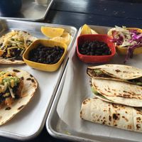 Sunday brunch: potato & bean tacos (left). Jackfruit barbacoa tacos w/ coleslaw  at La Botanica in San Antonio