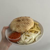 ćevapčići, lepinja, ajvar, onion and fries (i ordered this at home, so it’s mine terrible plating not theirs)  at Vege Fino Za Sve in Zagreb