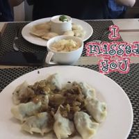Vegan dumplings with spinach, tofu, and tomatoes & vegan sauerkraut salad at Pierogarnia Mandu Oliwa in Gdansk
