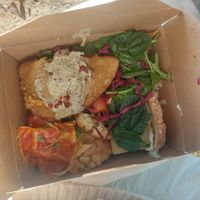 to go box from dinner buffet, some salad, seitan, lasagna, cauliflower, bread with tofu dip (there's more burried under there) at daTerra - Baixa in Porto