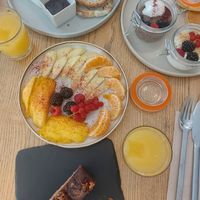 Fruits, bread with jam, banana bread, chia pudding and joghurt with muesli, pancakes at daTerra - Baixa in Porto