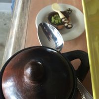 Chickpea dish in cute pot and spicy sauce at Queen of Sheeba in West Palm Beach