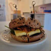 Vegan breakfast bagel. You have the choice of plain onion and everything bagel. The coconut bacon is to die for! at Morning Brew - Kailua in Kailua