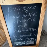 Board with prices at entrance  at Bambú in Vigo