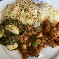 Saffron + cumin rice, peas rice, Chana massala and aloo palak  at The Rajpoute in Ornex