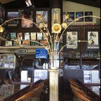 poster wall and floor lamp at Malibu House in Okinawa