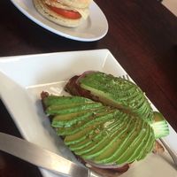 Avocado toast and breakfast sandwich with tempeh, tomato, and vegan pepper jack!  at Green Street Market in Rio Grande