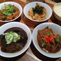 Clockwise from top left: sichuan pepper and black bean tofu; miso potatoes, pickled wakame, crispy shallots; sweet soy and coconut tempeh; black pepper aubergine, pickled cucumber at The Hug and Pint in Glasgow
