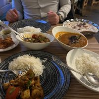 Saucy aubergine curry to the right   at Indian Temptation in Bath