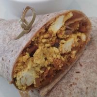 Vegan tofu scramble wrap with soyrizo, pasilla chili and a side of ansazi beans for brunch. at True Food Kitchen in Houston