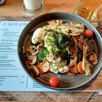 Truffled mashed potatoes with fried mushrooms, fried arugula and vegetables. In the left corner you see the vegan section of the menu. at Taufsteinhutte in Schotten