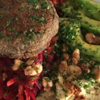 The "Vegan Kick": lentil patty; grated beetroot and carrot; hummus; avocado; walnuts; tomato relish at Motion Cafe in Canggu