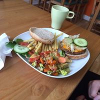 Cheeseburger with salad and fries. at The Green Room in Warrington