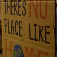 there's no place like home with a globe sign at VeganBurg in San Francisco