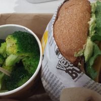 Super delicious burger w/side of broccoli!! at VeganBurg in San Francisco