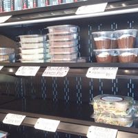 Cold case with desserts, elixir shots, and pre-made salads at Rooted Juicery + Kitchen - Madison Rd in Cincinnati