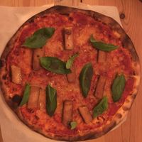 Vegan pizza with extra tofu sausages at In Bocca Al Lupo in Lisbon