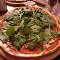 Pizza with vegan cheese, mushrooms, onion and spinach. at In Bocca Al Lupo in Lisbon