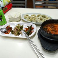 steamed dumplings and kimchi and spicy sausage stew at SaRangBunSik - 사랑분식 in Seoul