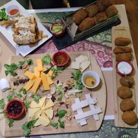 So much food!! Vegan cheese board, jumbo artichoke croquettes, spinach and mushroom croquettes, and faux duck spring rolls. at Crock and cock in Bilbao
