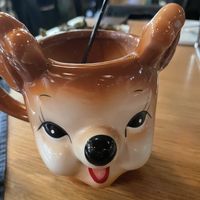Yummy vegan seasonal cocktail with coconut milk and creepy cute mug  at Trophy Brewing in Raleigh