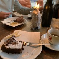 Vegan chocolate cake. Nice coffee, always served with big wine bottle, filled with water. at 7Stern in Vienna