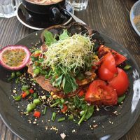 Corn fritters with extra sides of tomatoes and mushrooms at Blendlove in Southport