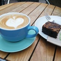 Caramel brownie, oat milk latte at Cafe Mbriki in Leicester