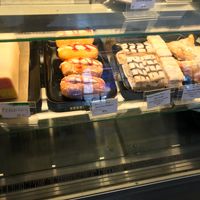 Full row of fresh vegan cakes including Battenberg cake! There were also vegan cupcakes ontop of the counter and a vegan chocolate/coconut slice!  at Cafe Mbriki in Leicester