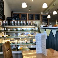 Interior with cake counter at Cafe Mbriki in Leicester