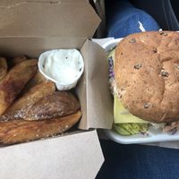 Sausage burger with cheese and coleslaw and skin on chips with aoli 😋 at The Wallflower Cafe in Herne Bay