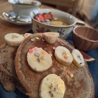 Pancakes with rainbow dots and golden glitter ✨ at Cafe Herzstück in Goerlitz